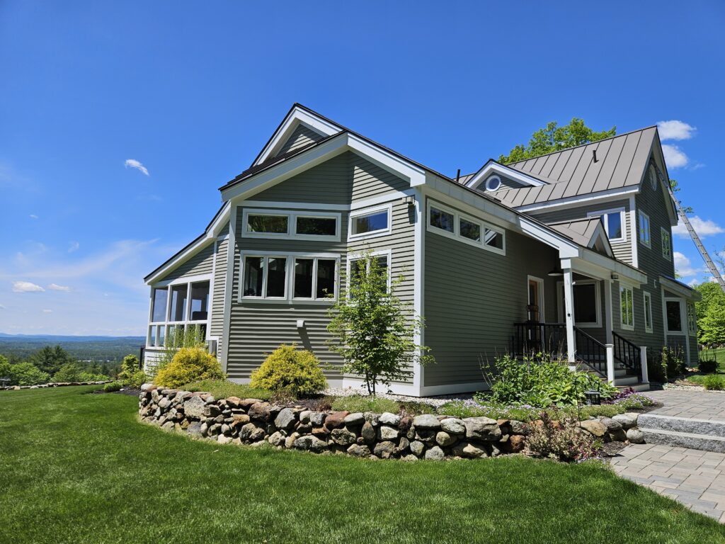 Green home with white trim in Hopkinton